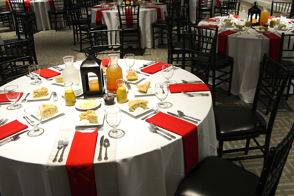 Set tables of linens and napkins.